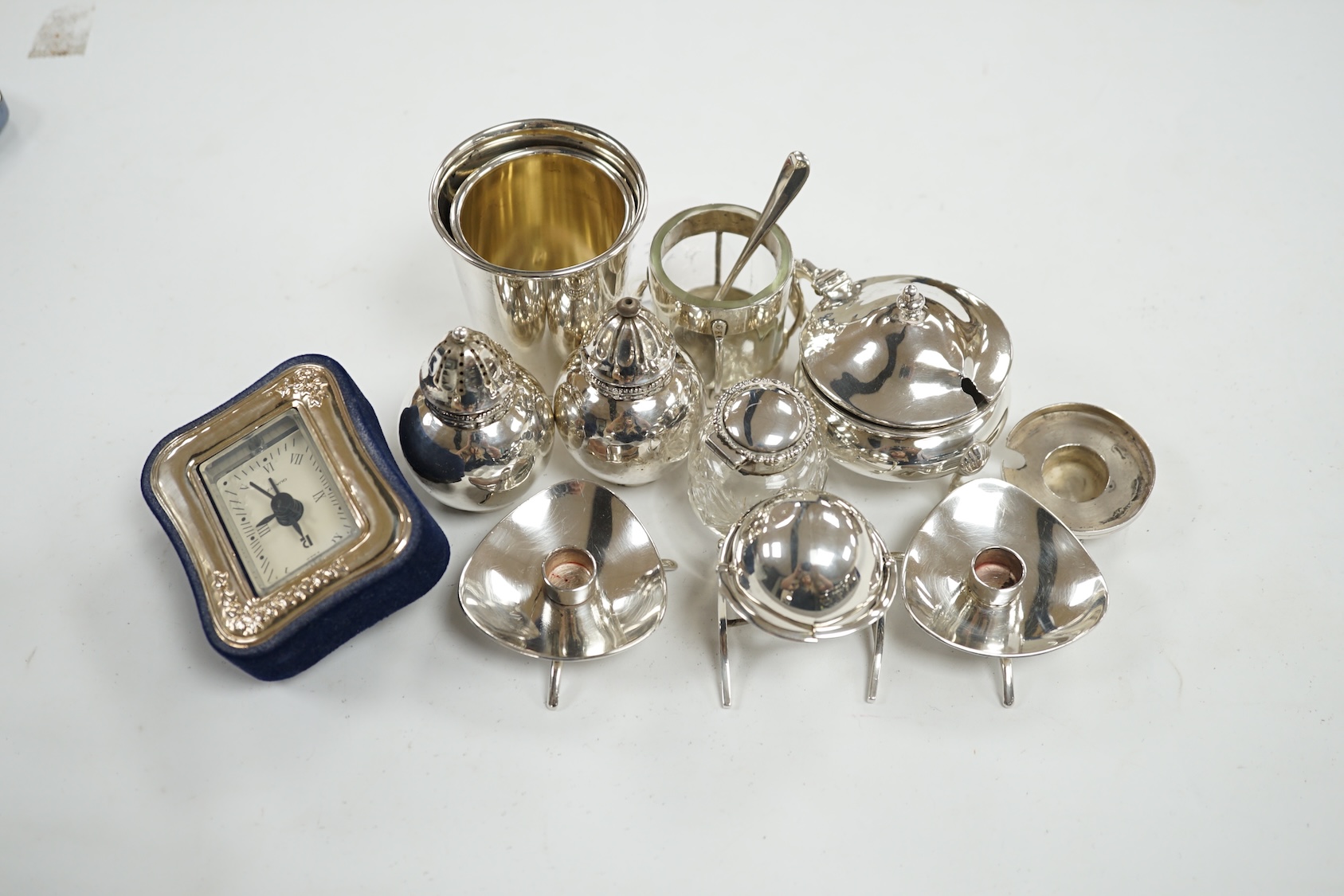 Small silver including an Edwardian miniature silver revolving 'breakfast dish' by Saunders & Shepherd, Birmingham, 1909, height 50mm, four condiments including one modelled as a ship's lamp and two Danish white metal, a